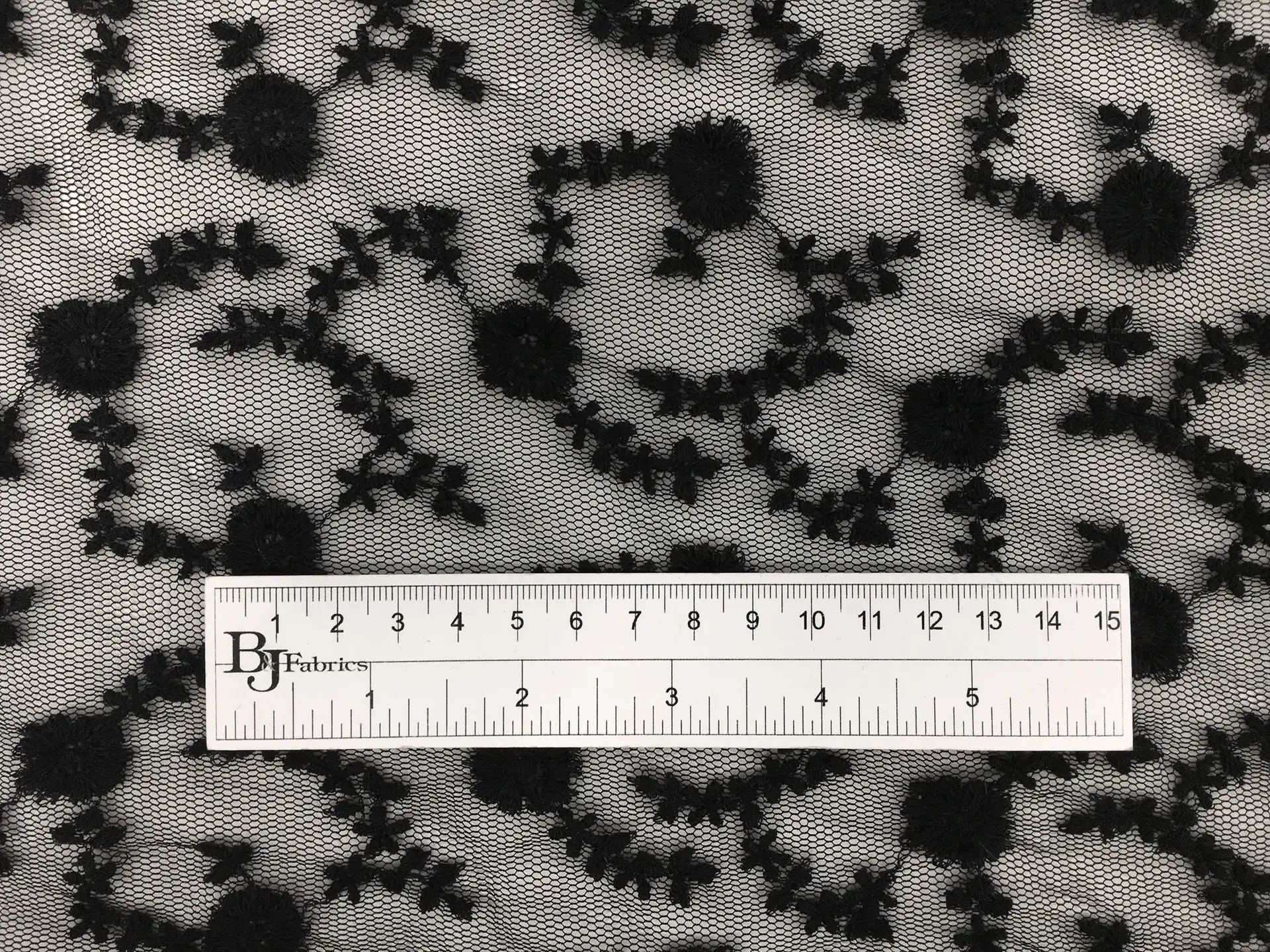 Embroidered Polyestser Bobbinet with Floral Motifs