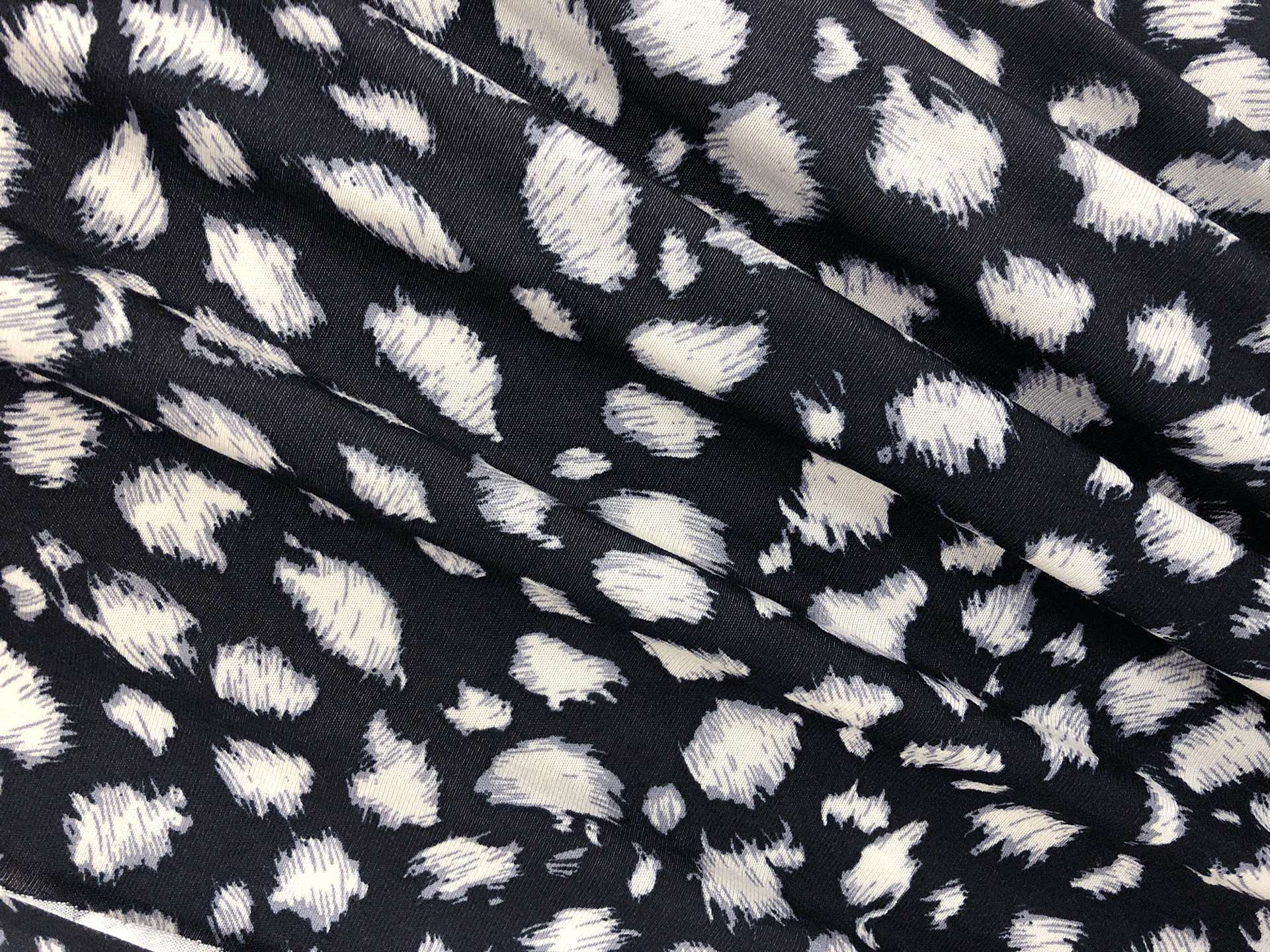 Rayon Jersey with Snow Leopard Print in Black and Bone