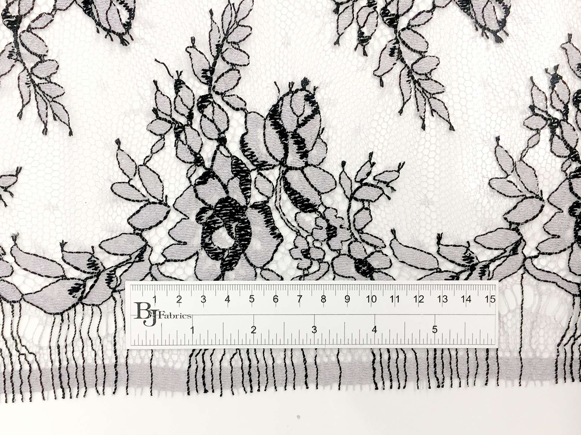 Chantilly Lace in Light Lavender with Black Outlines of Florals