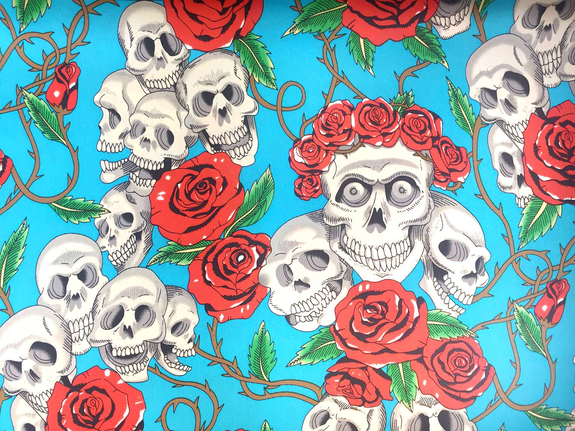 Printed Silk Charmeuse with Skulls and Roses in Blue Background