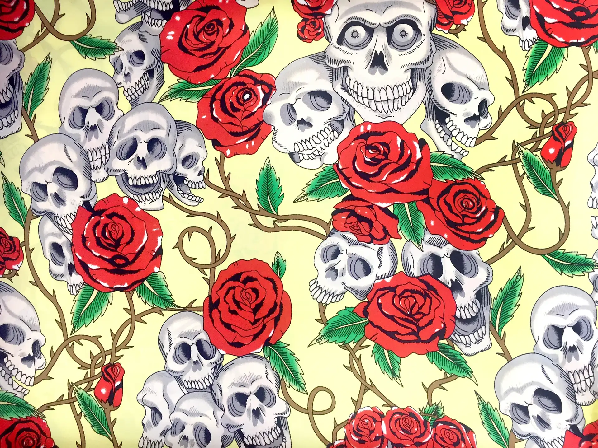 Printed Silk Charmeuse with Skulls and Roses on Yellow Background
