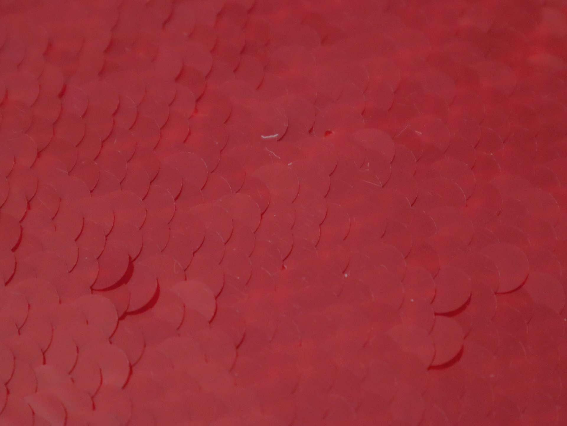 Transparent Mini-Paillettes on Stretch Tulle in Red