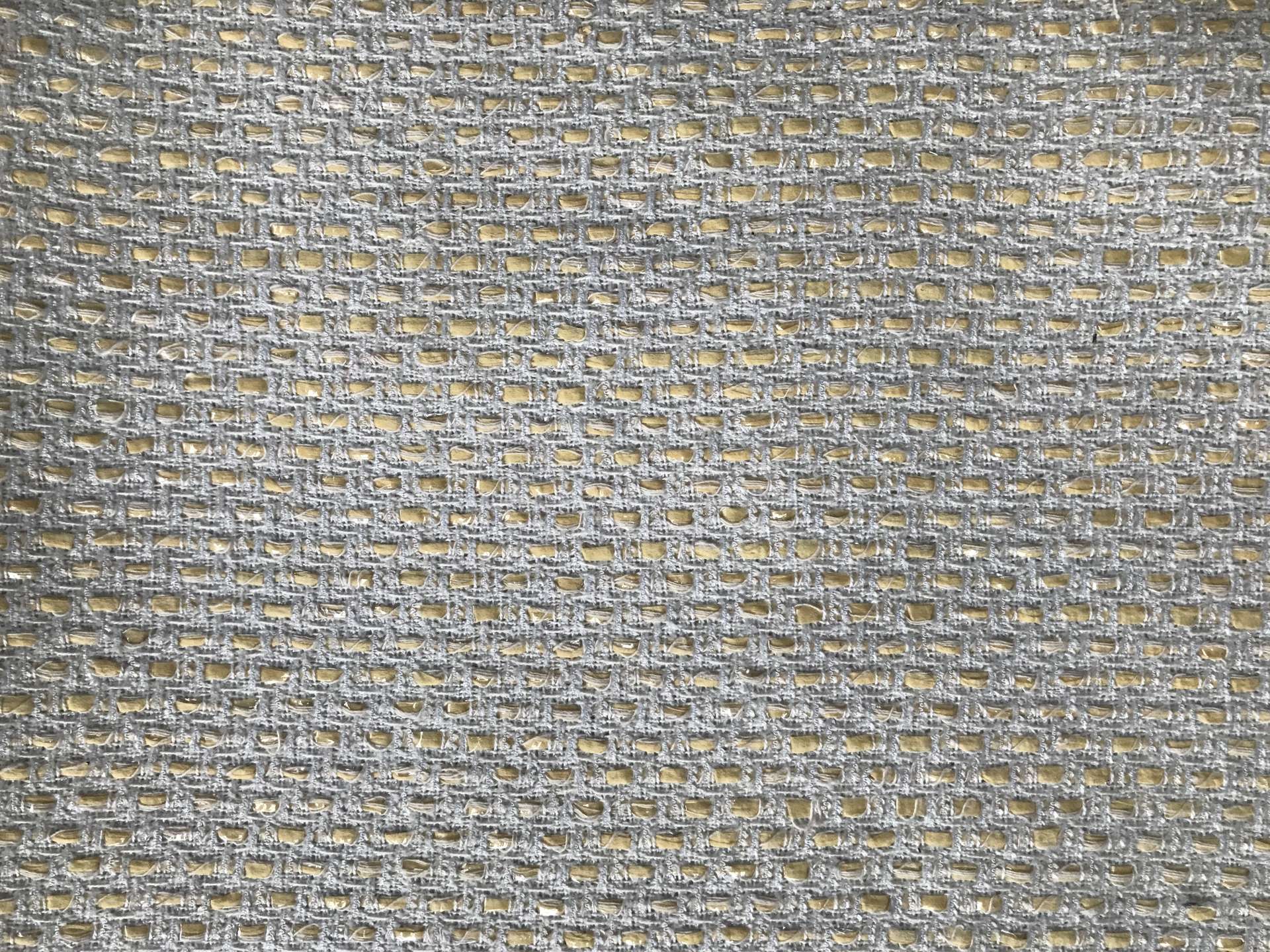 flat lay of white tweed woven with offwhite raffia 