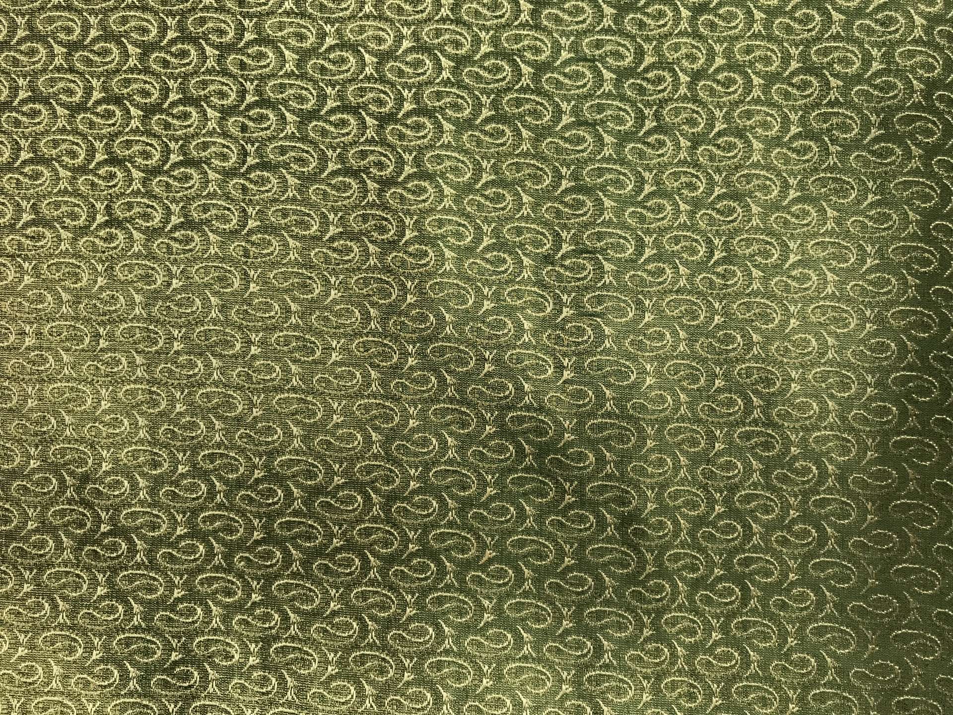 metallic green and gold brocade with repeating gold paisleys
