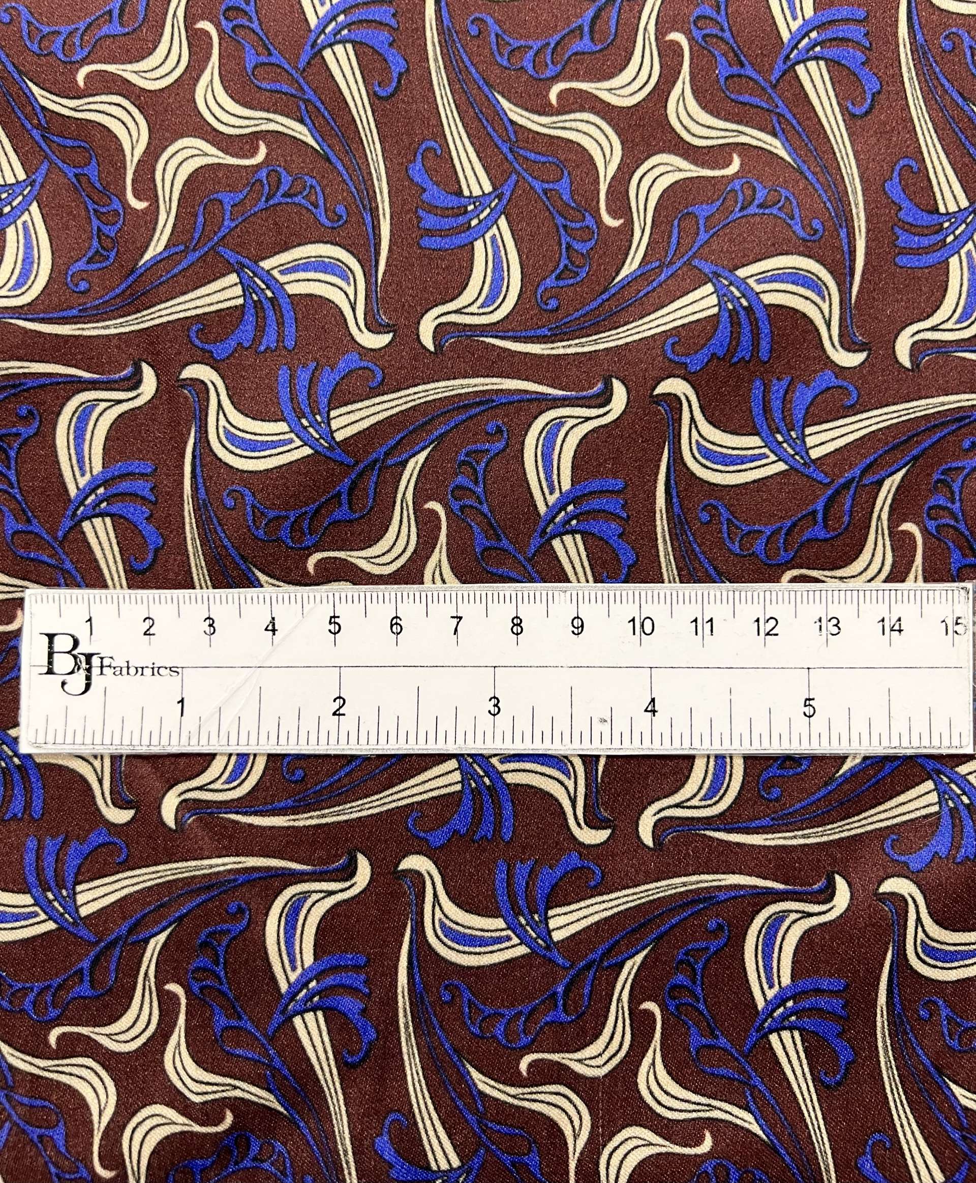 Printed Viscose Challis Sateen On Chocolate Ground