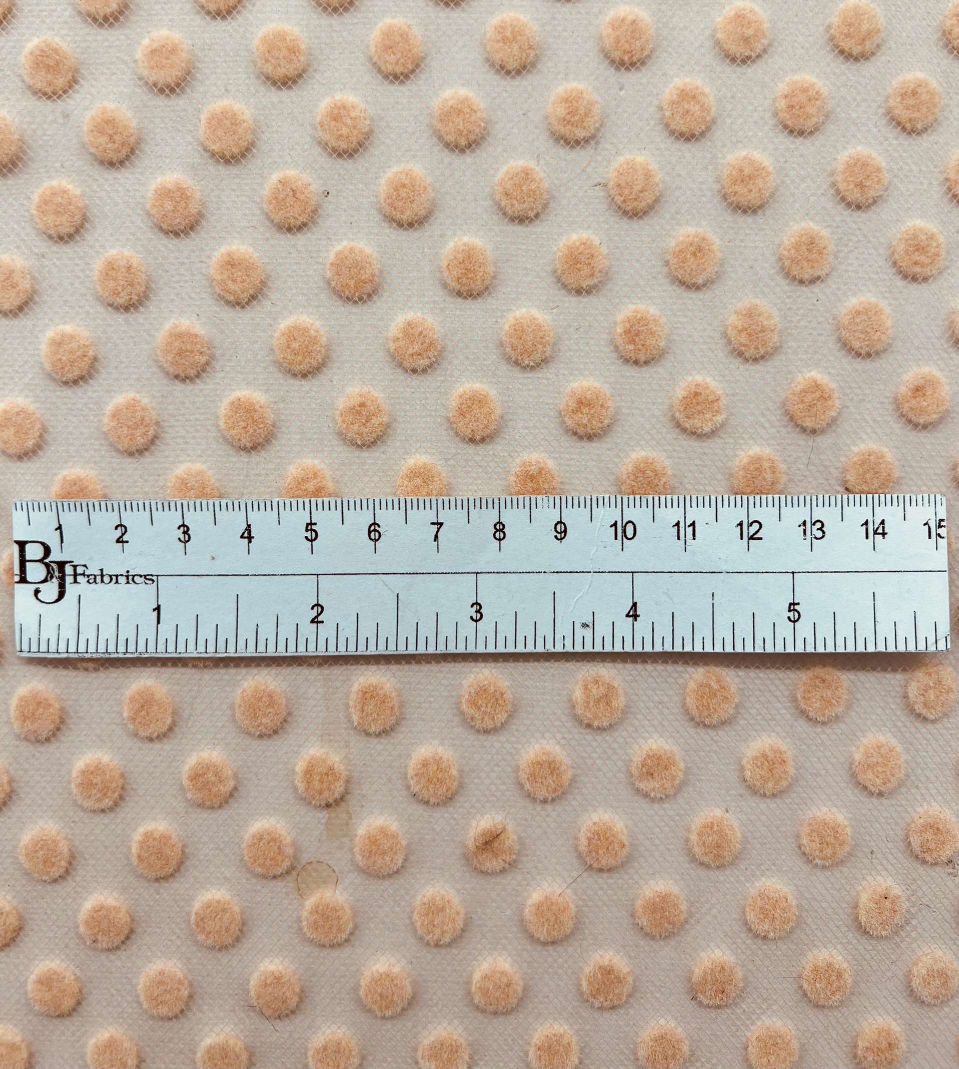 Flocking on tulle in Peach
