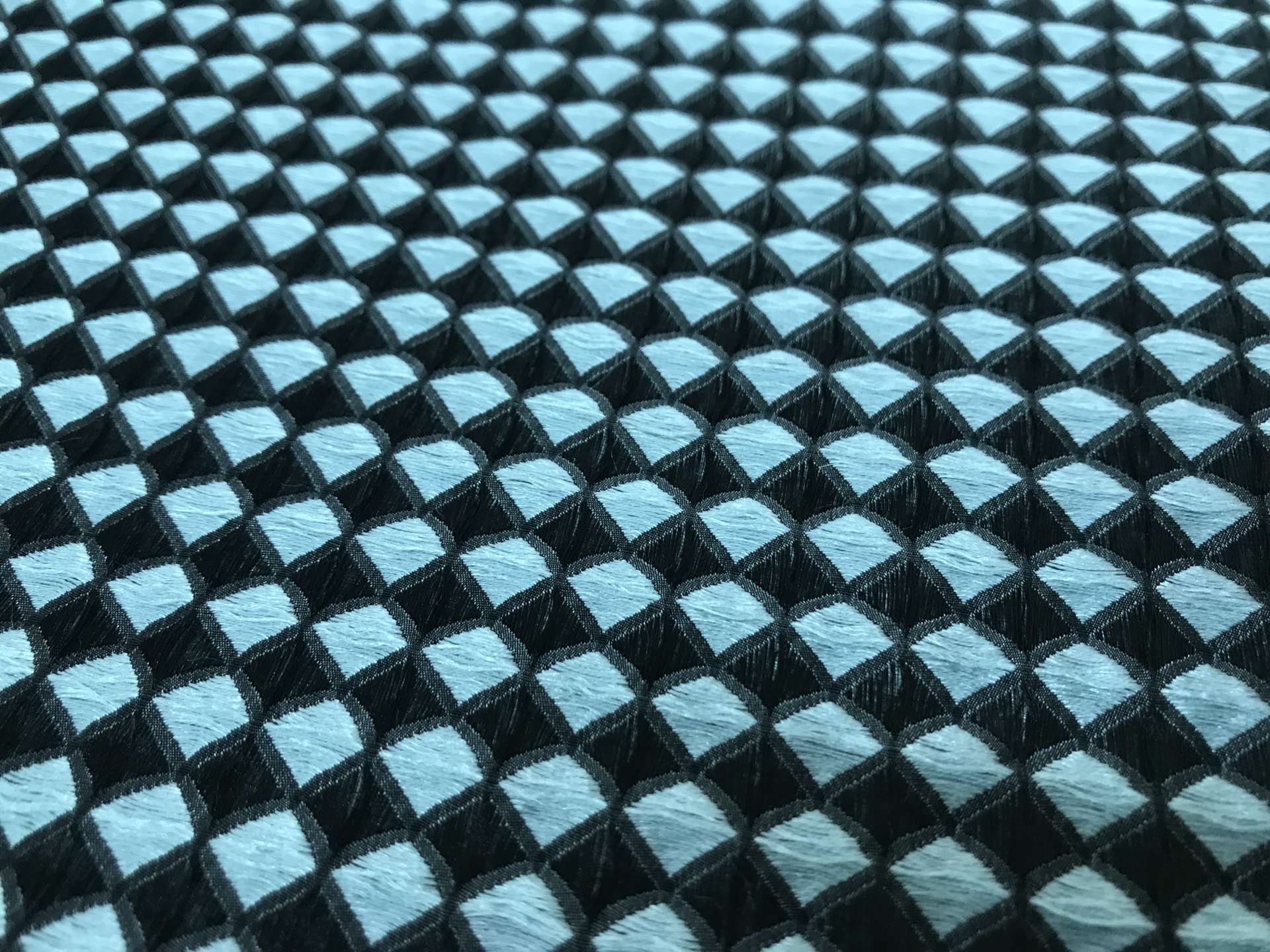 diamond geometric brocade in black and powder blue closeup to show texture
