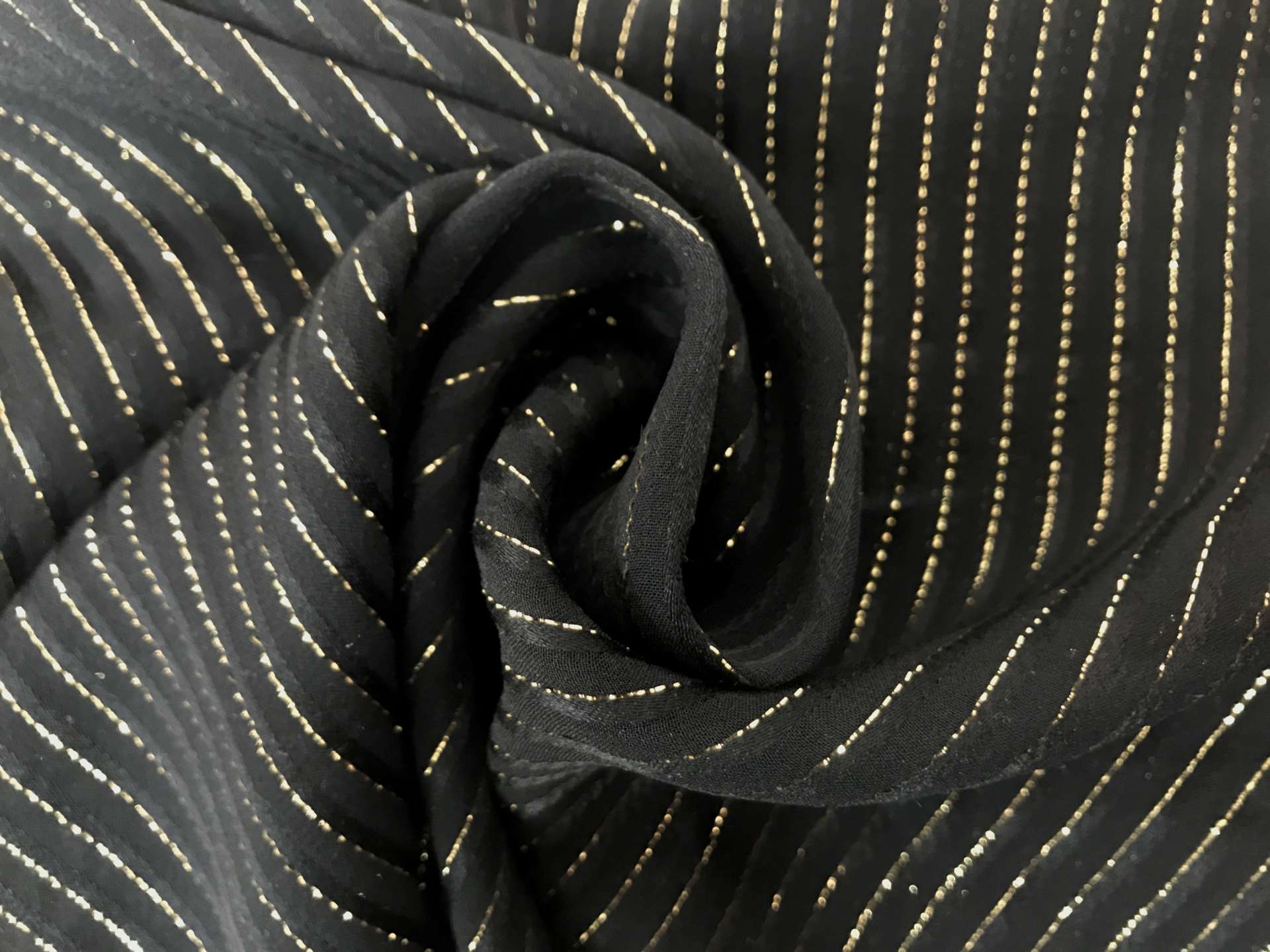 black silk chiffon with gold metallic stripes in a swirl