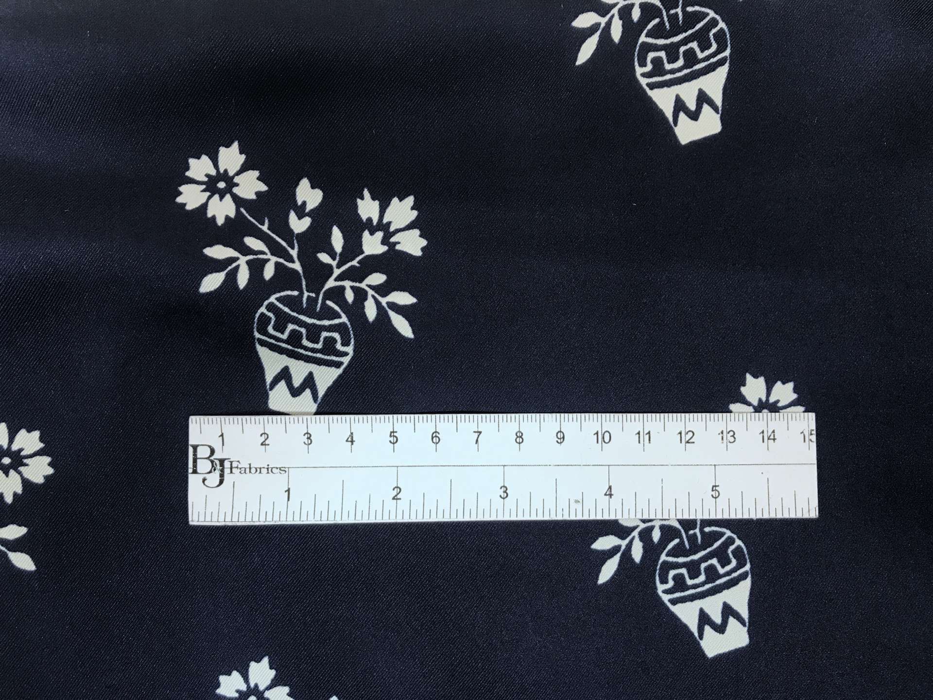 navy printed silk twill with white vases with flowers with ruler to show scale