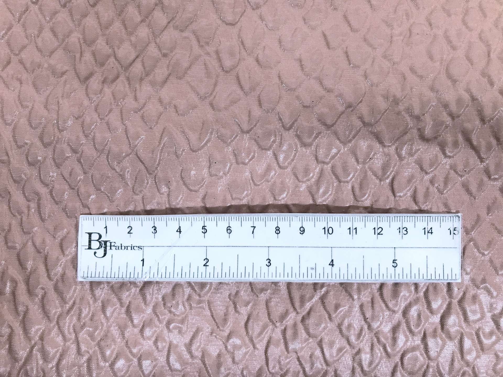 Italian Polyester Ciré Brocade with Crocodile Texture in Taupe with ruler to show scale