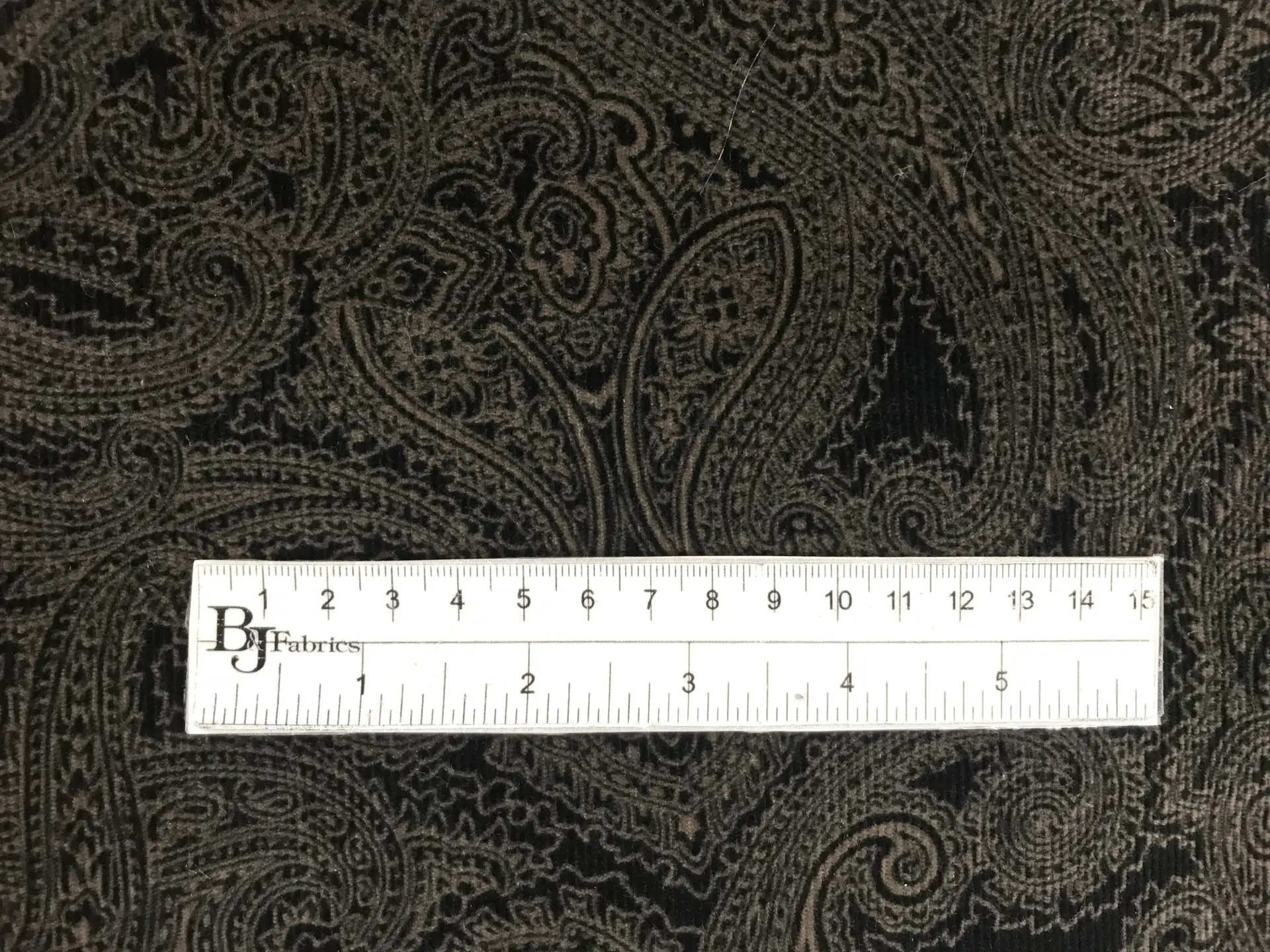Printed Stretch Cotton Velvet with Paisley Patterns with ruler to show scale