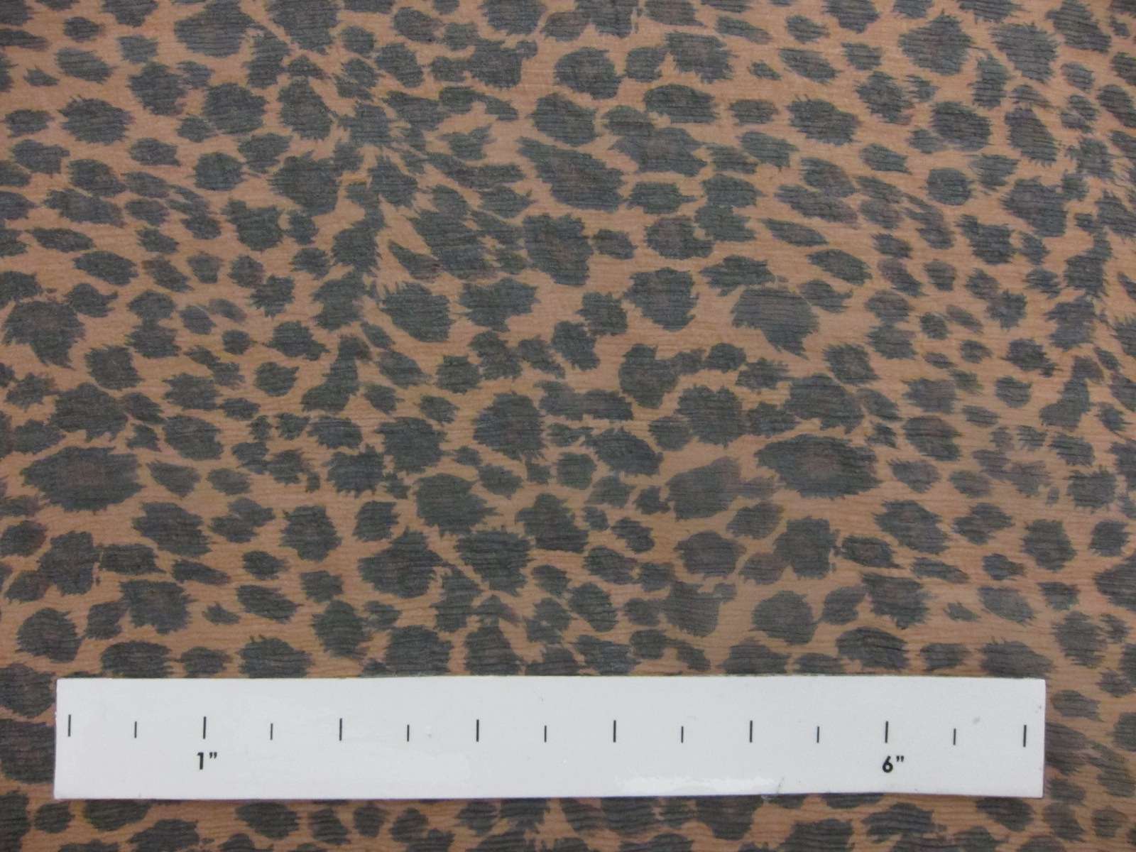 Printed Silk Chiffon Black Spots With Brown In The Middle Of Them On Orange Background