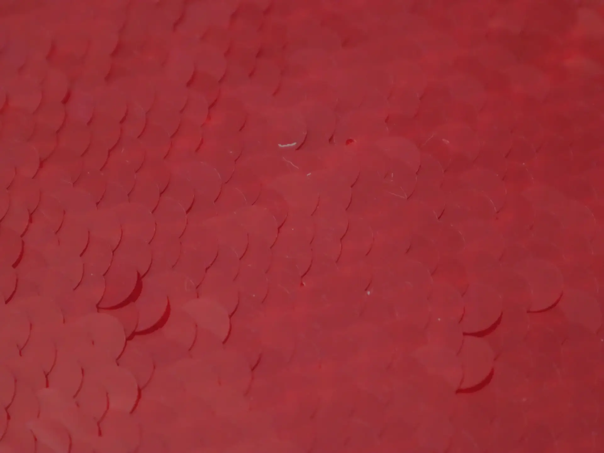 Transparent Mini-Paillettes on Stretch Tulle in Red