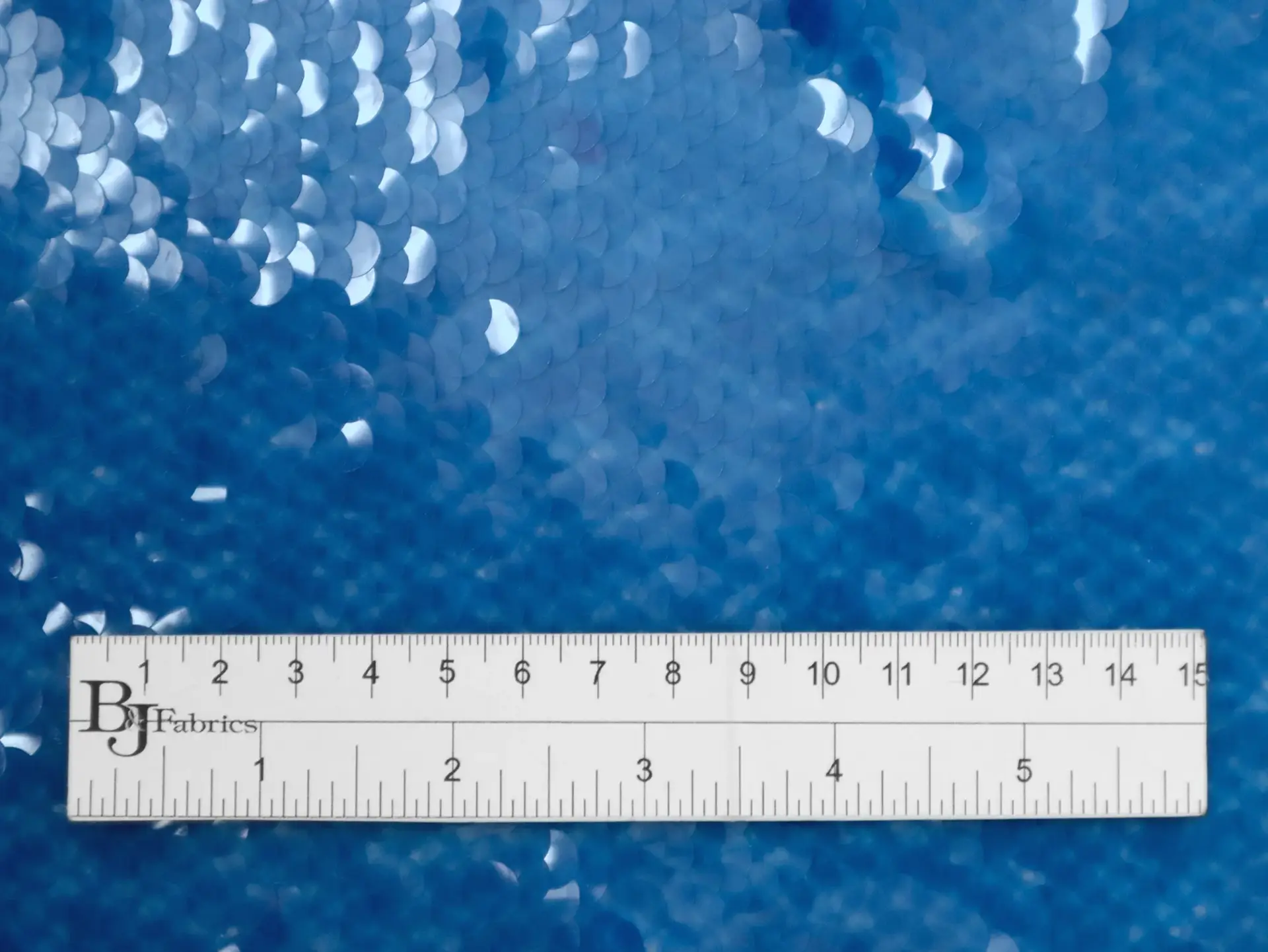 Transparent Mini-Paillettes on Stretch Tulle in Blue