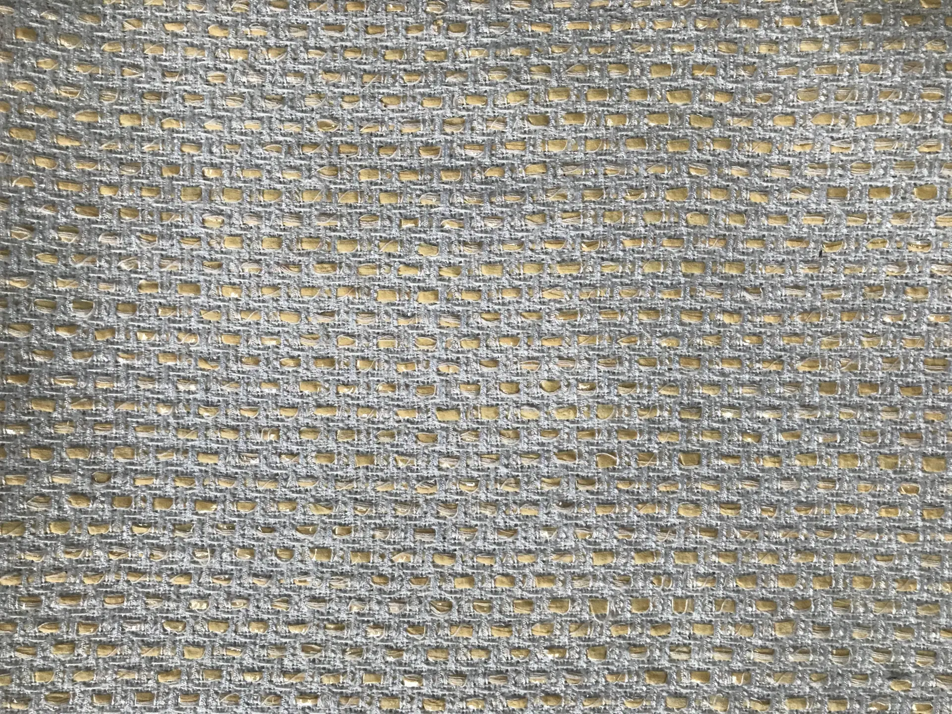 flat lay of white tweed woven with offwhite raffia 