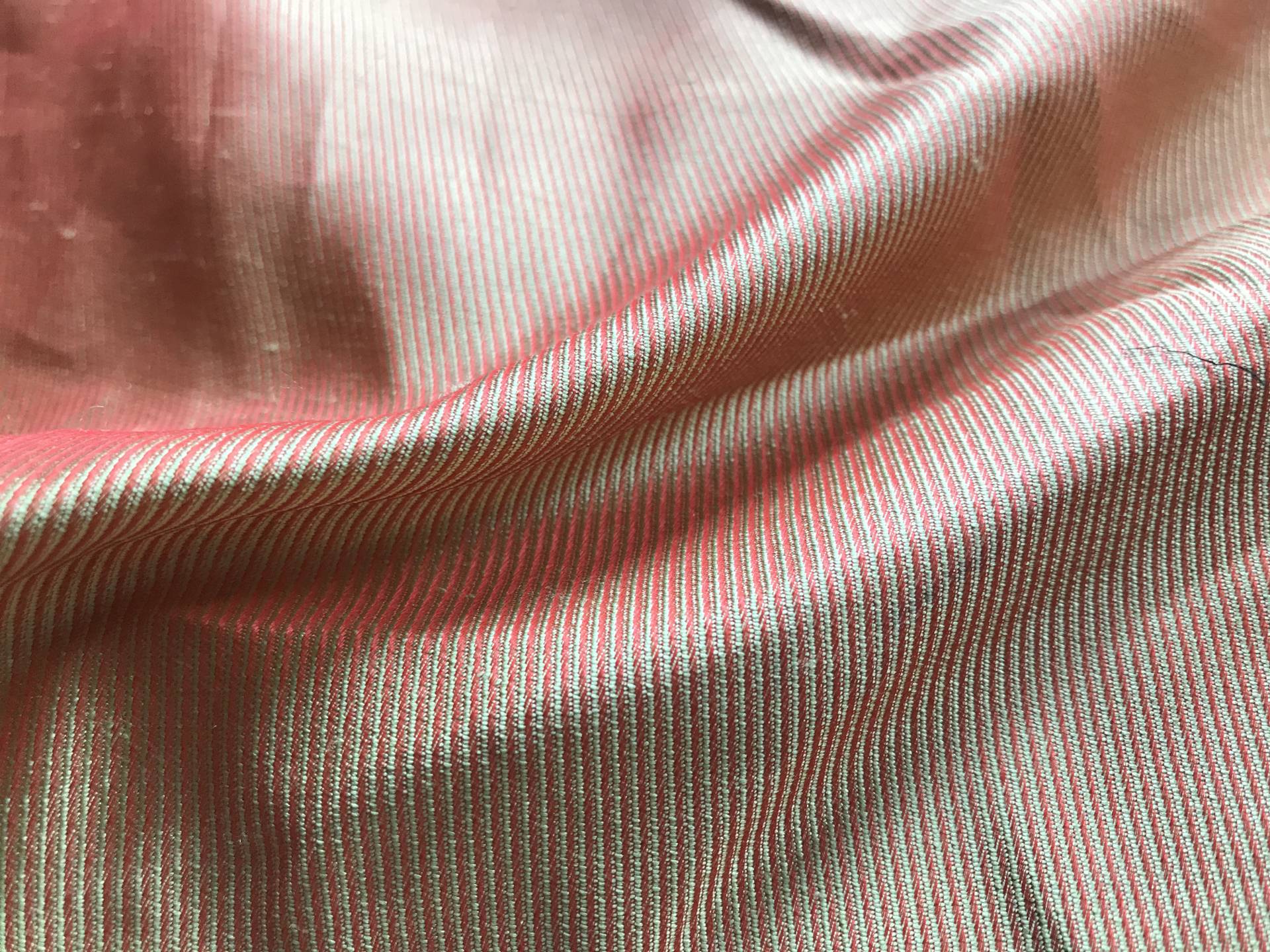 silk taffeta is folder to show the weave and iridescence