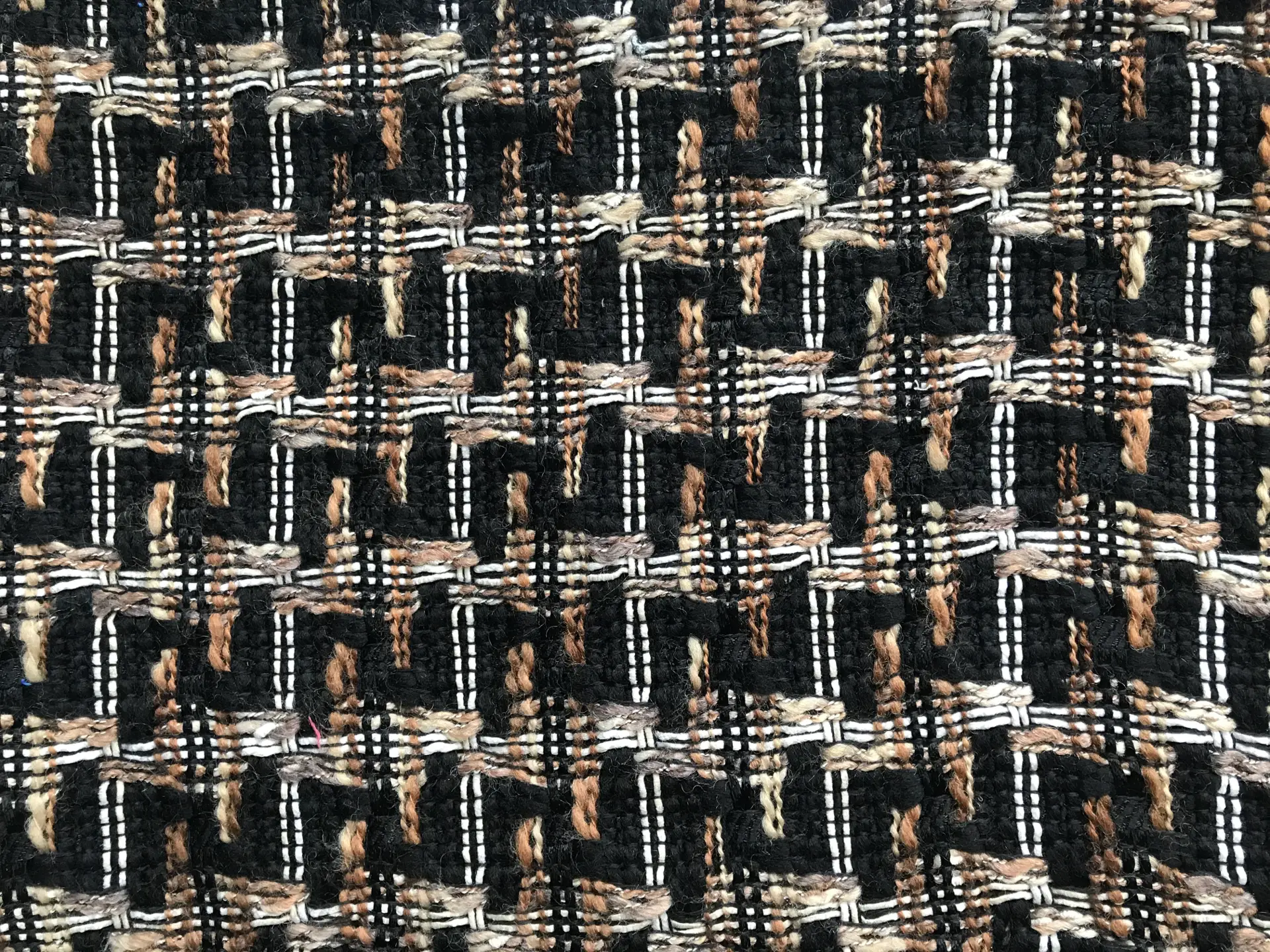 Black bouclé tweed with white, brown, tan woven plaid pattern