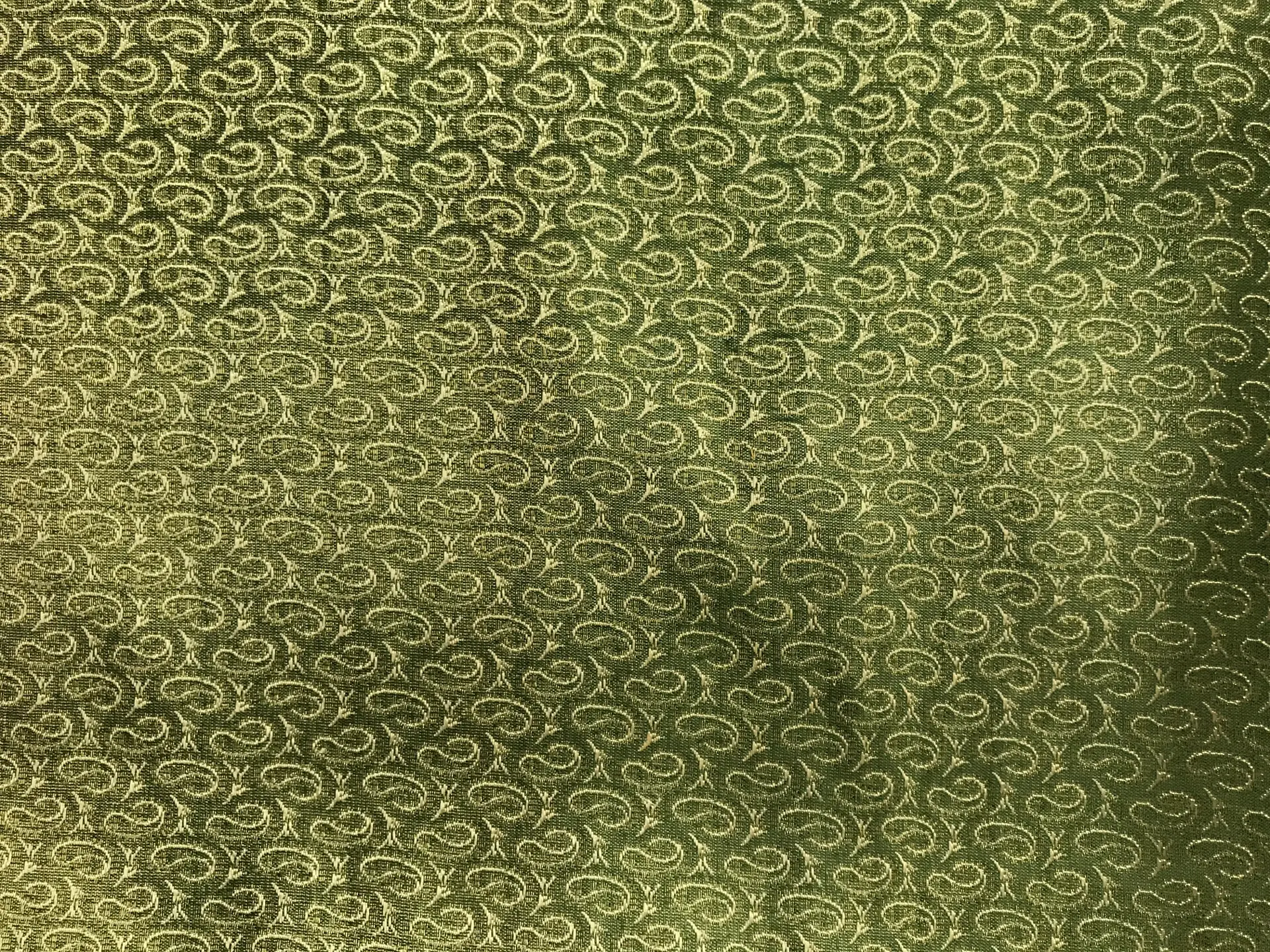 metallic green and gold brocade with repeating gold paisleys