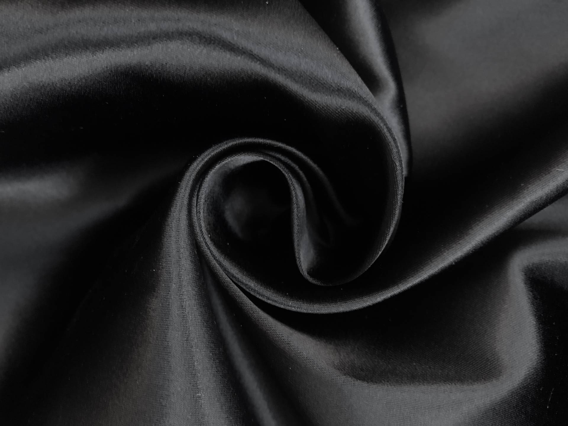 black stretch satin in a swirl
