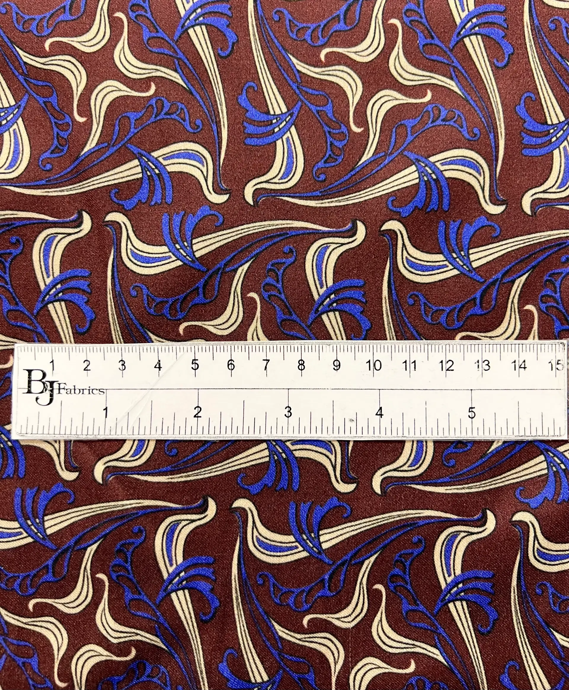 Printed Viscose Challis Sateen On Chocolate Ground