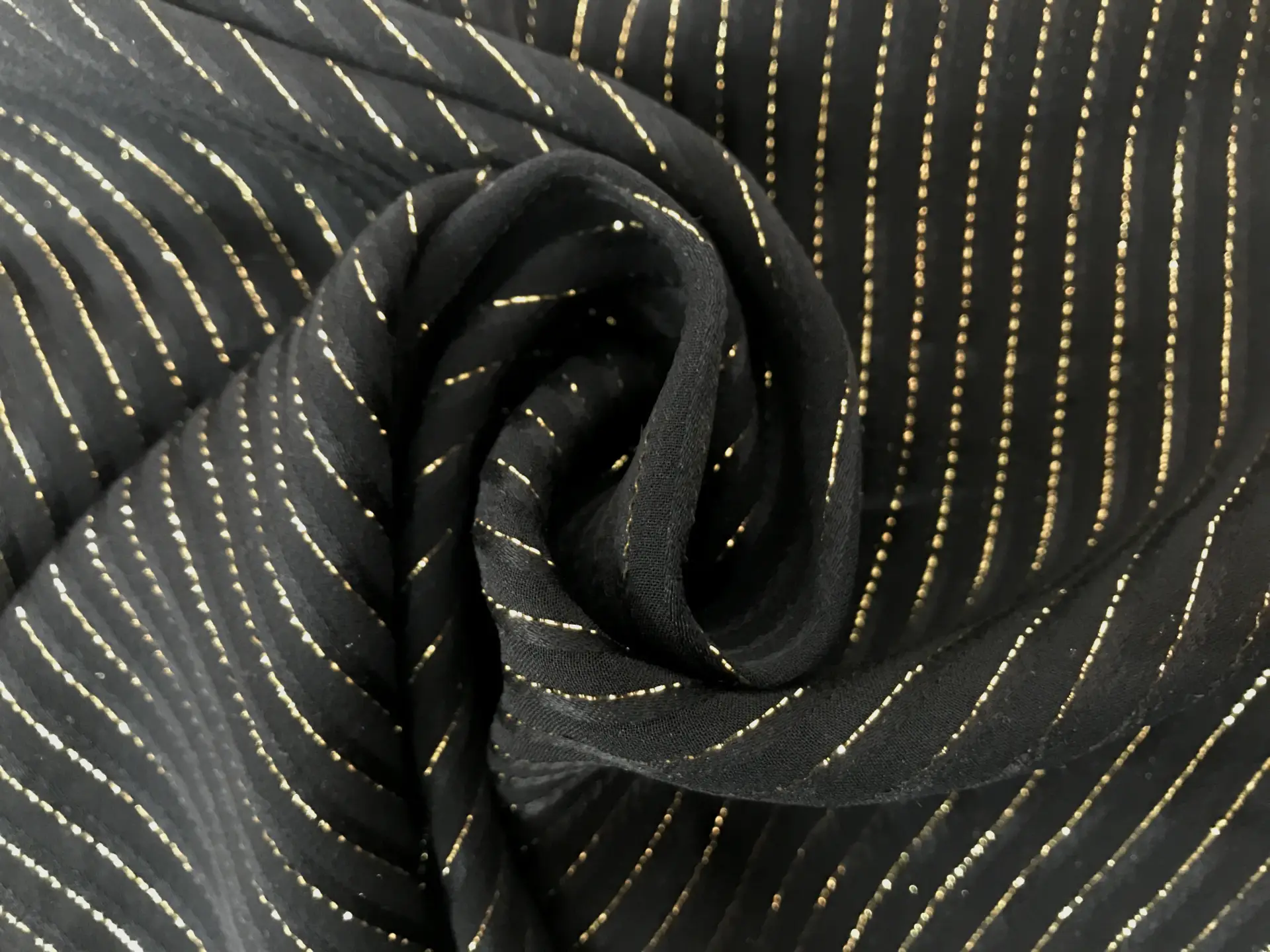 black silk chiffon with gold metallic stripes in a swirl
