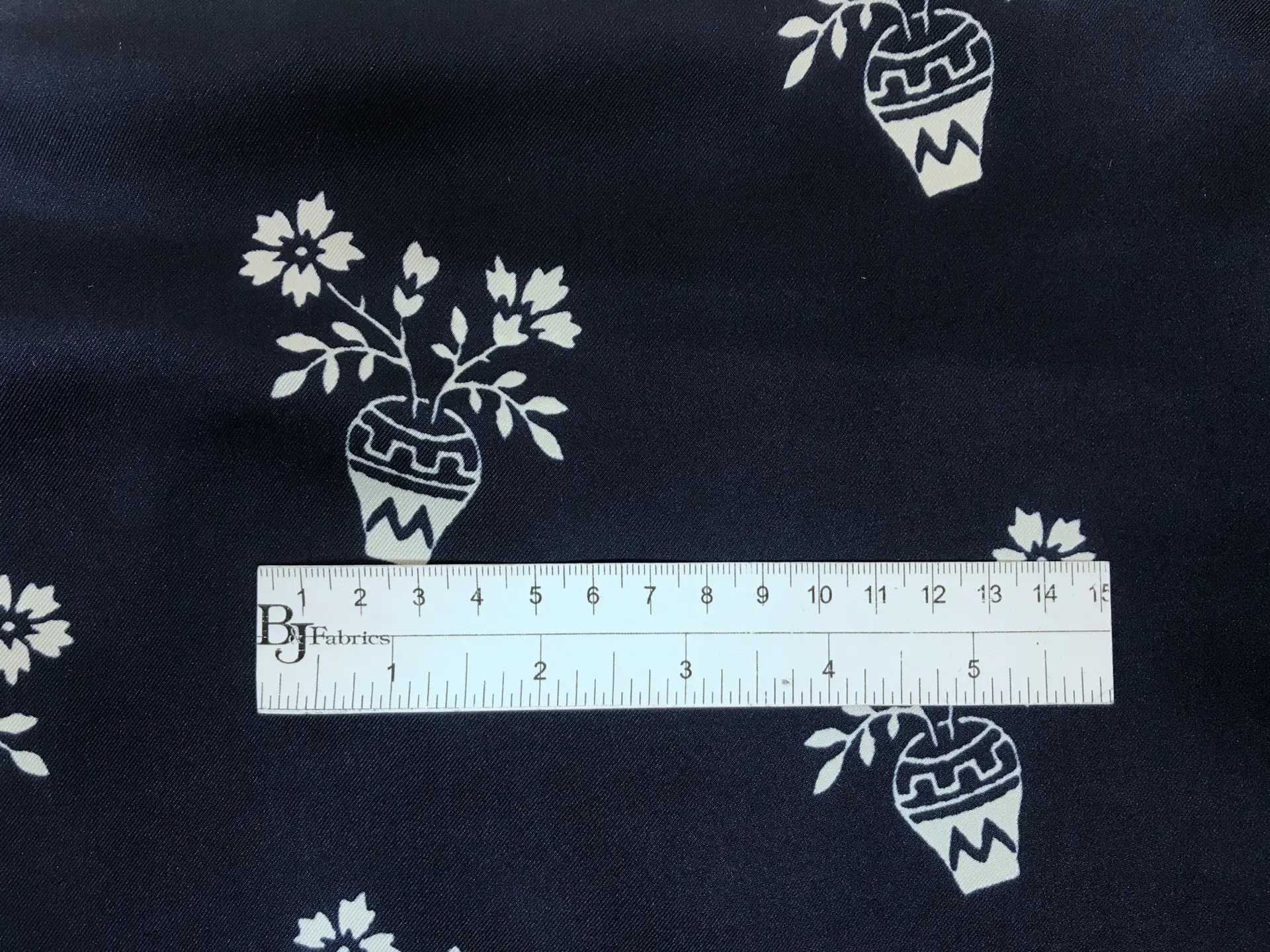 navy printed silk twill with white vases with flowers with ruler to show scale