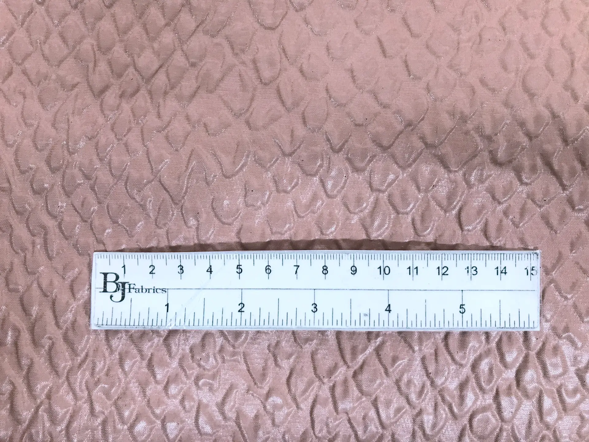 Italian Polyester Ciré Brocade with Crocodile Texture in Taupe with ruler to show scale