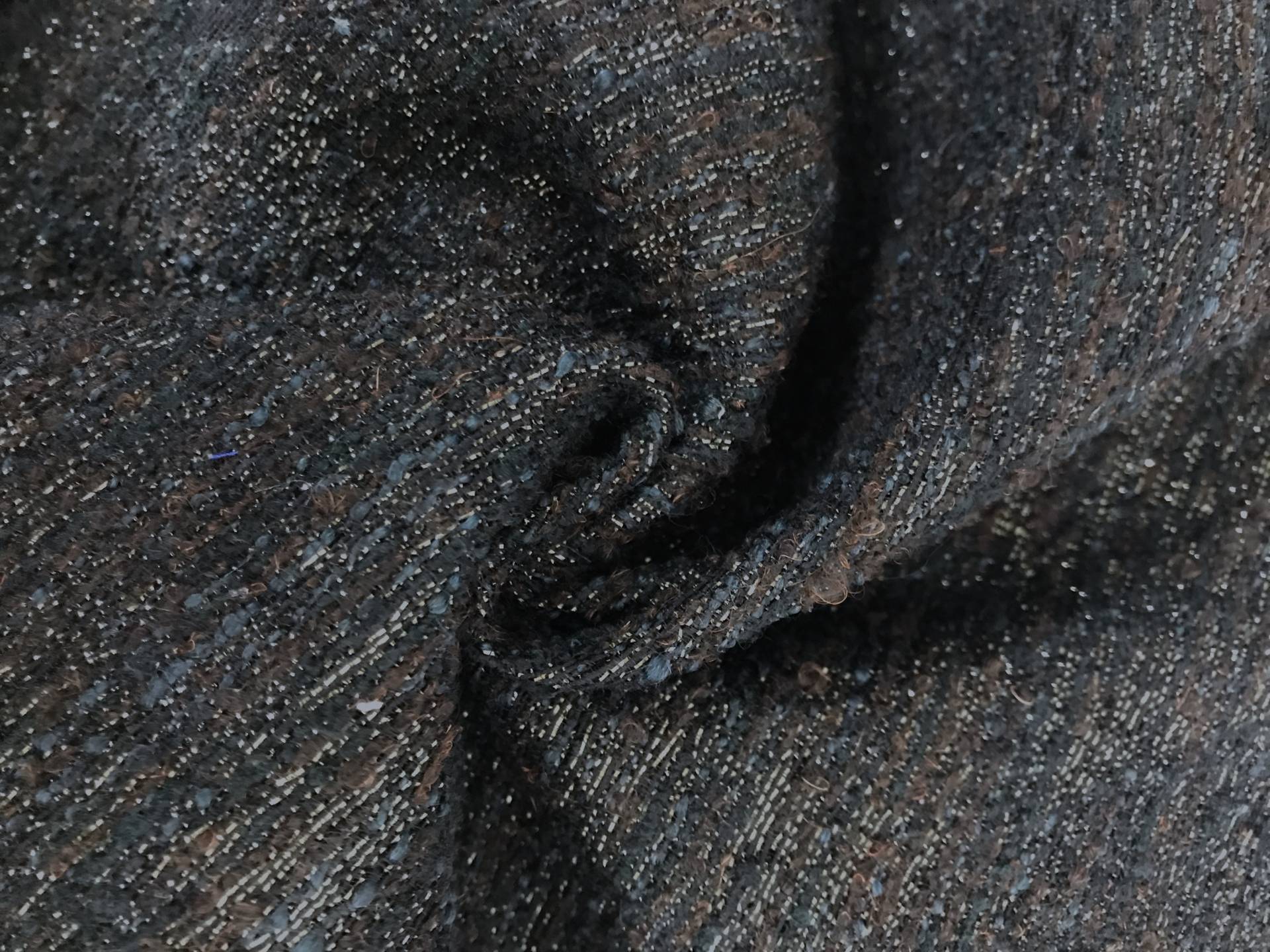 Italian Wool and Polyester Metallic Tweed in Black, Navy, and Brown in a swirl to show texture