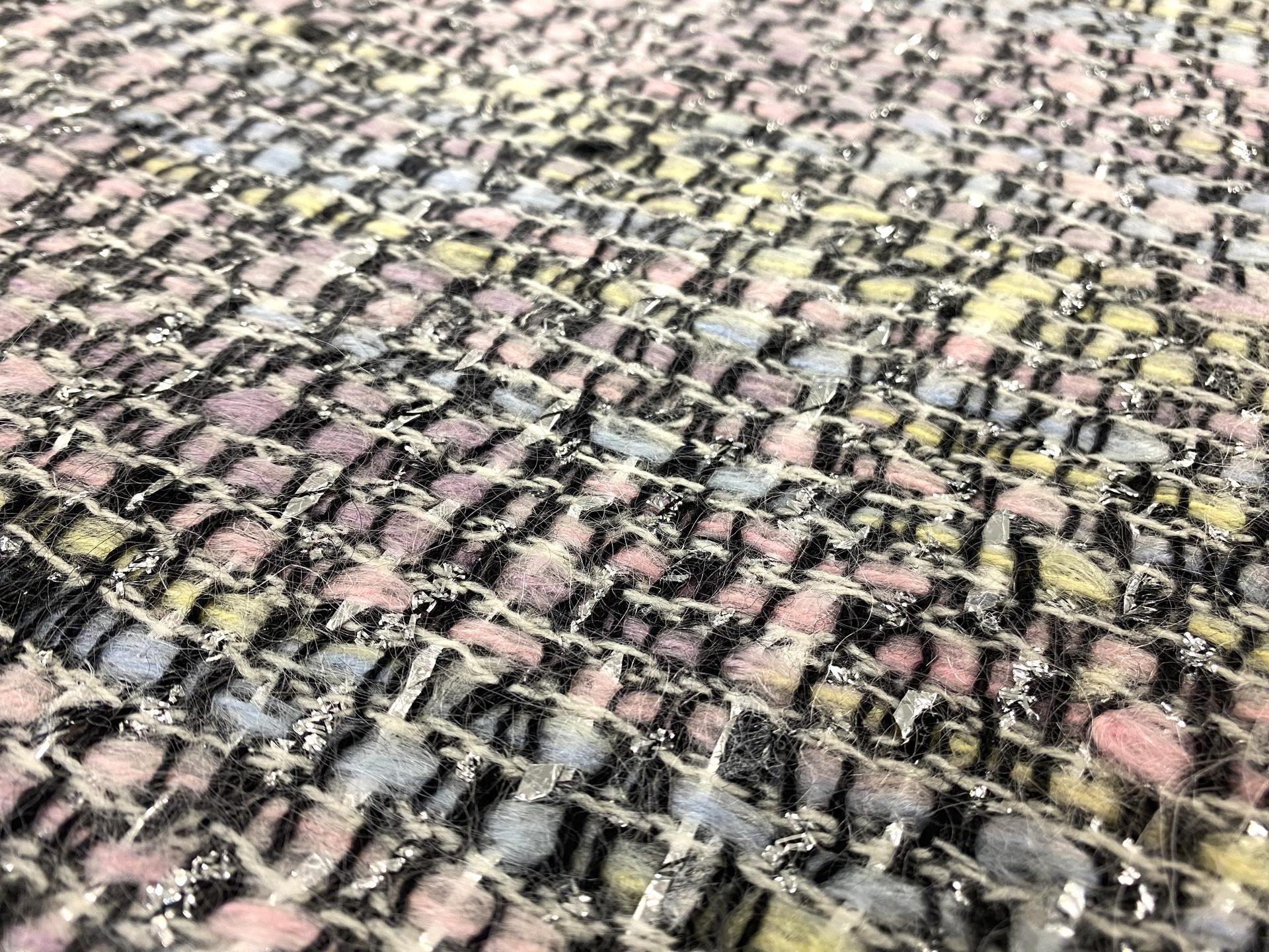 Wool and mohair lurex tweed fabric in warehouse