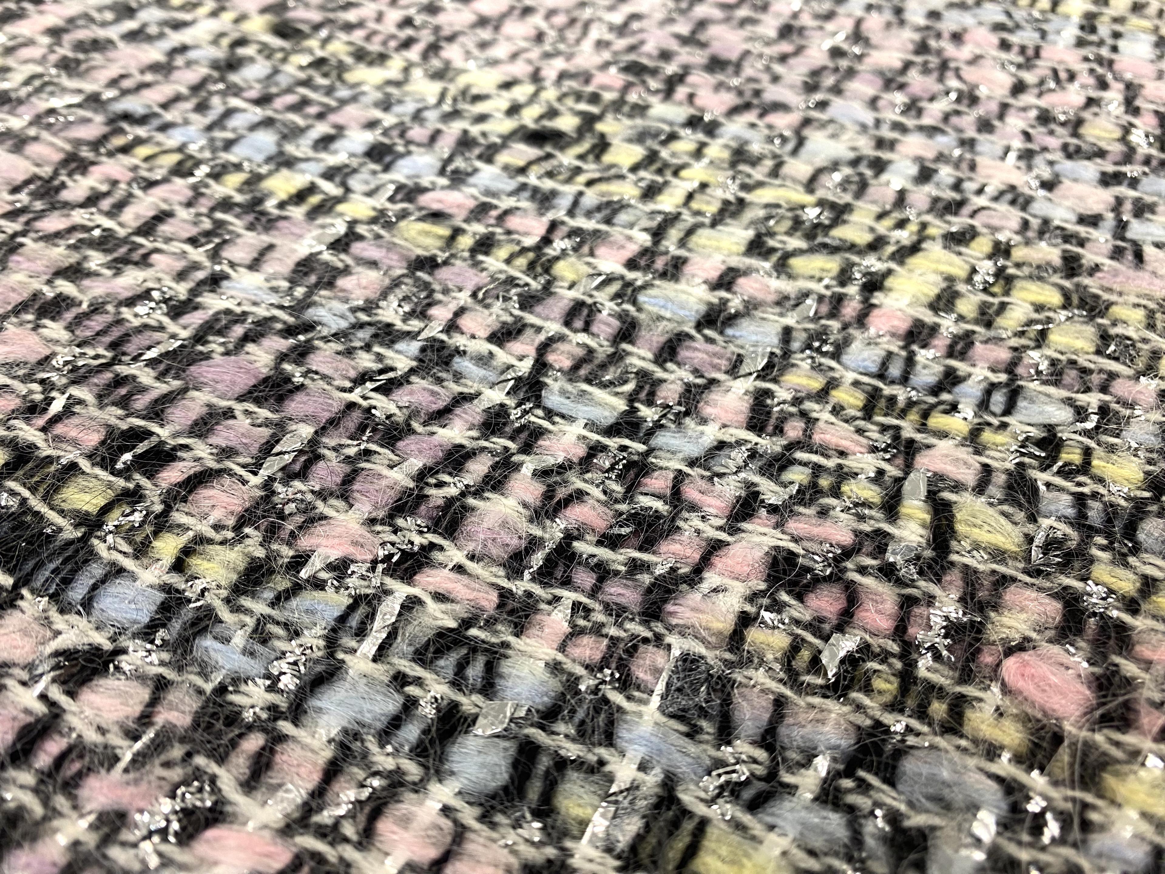 Wool and mohair lurex tweed fabric in warehouse
