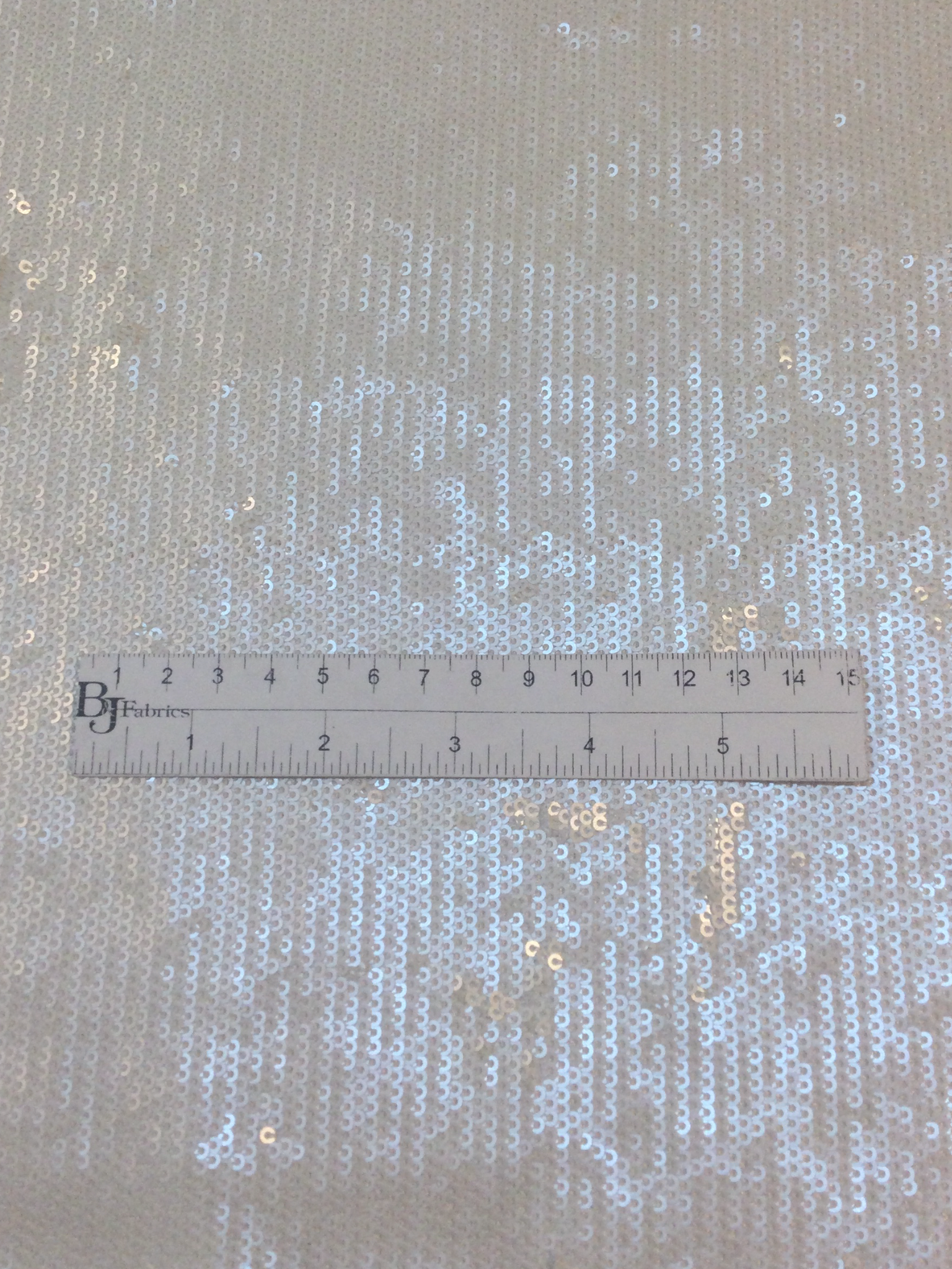 Mini Sequins on Polyester Jersey in White