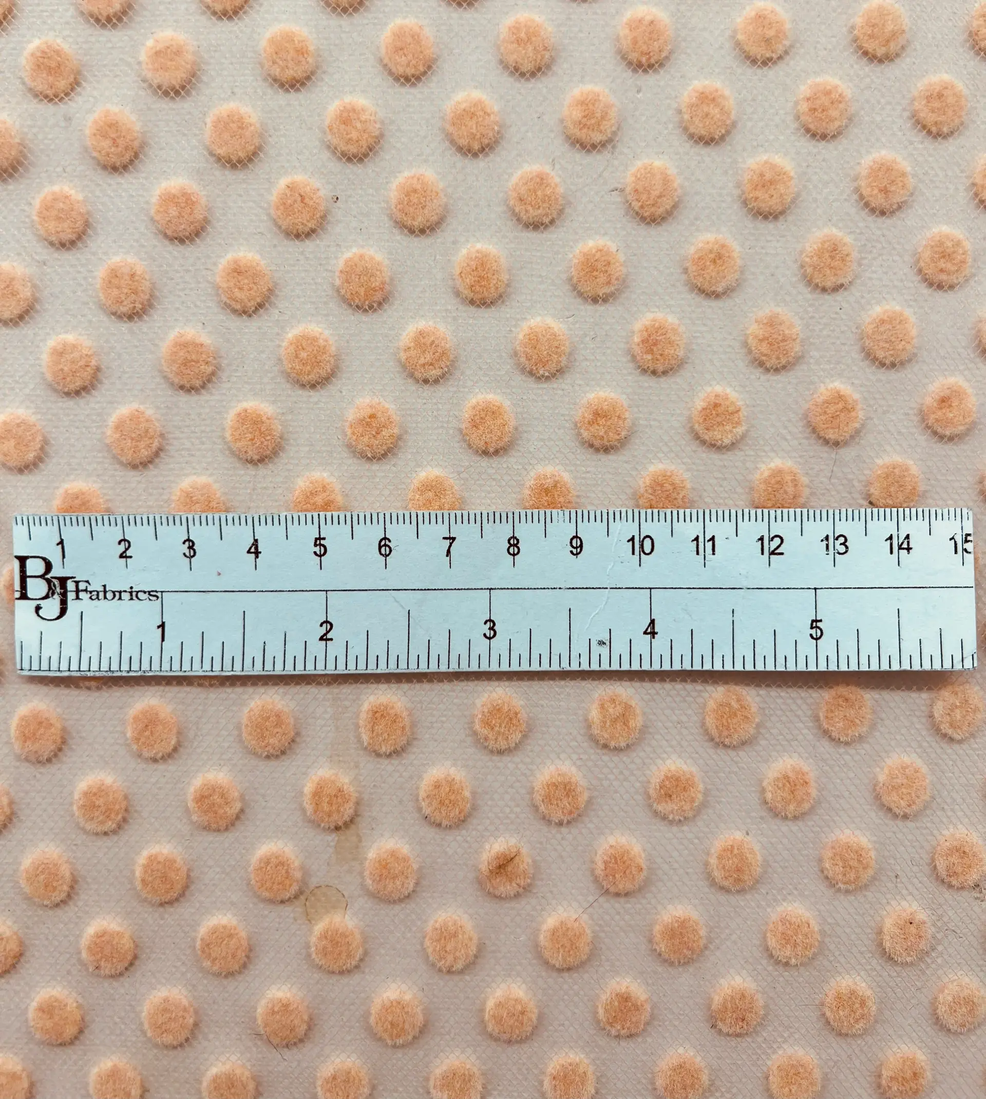Flocking on tulle in Peach