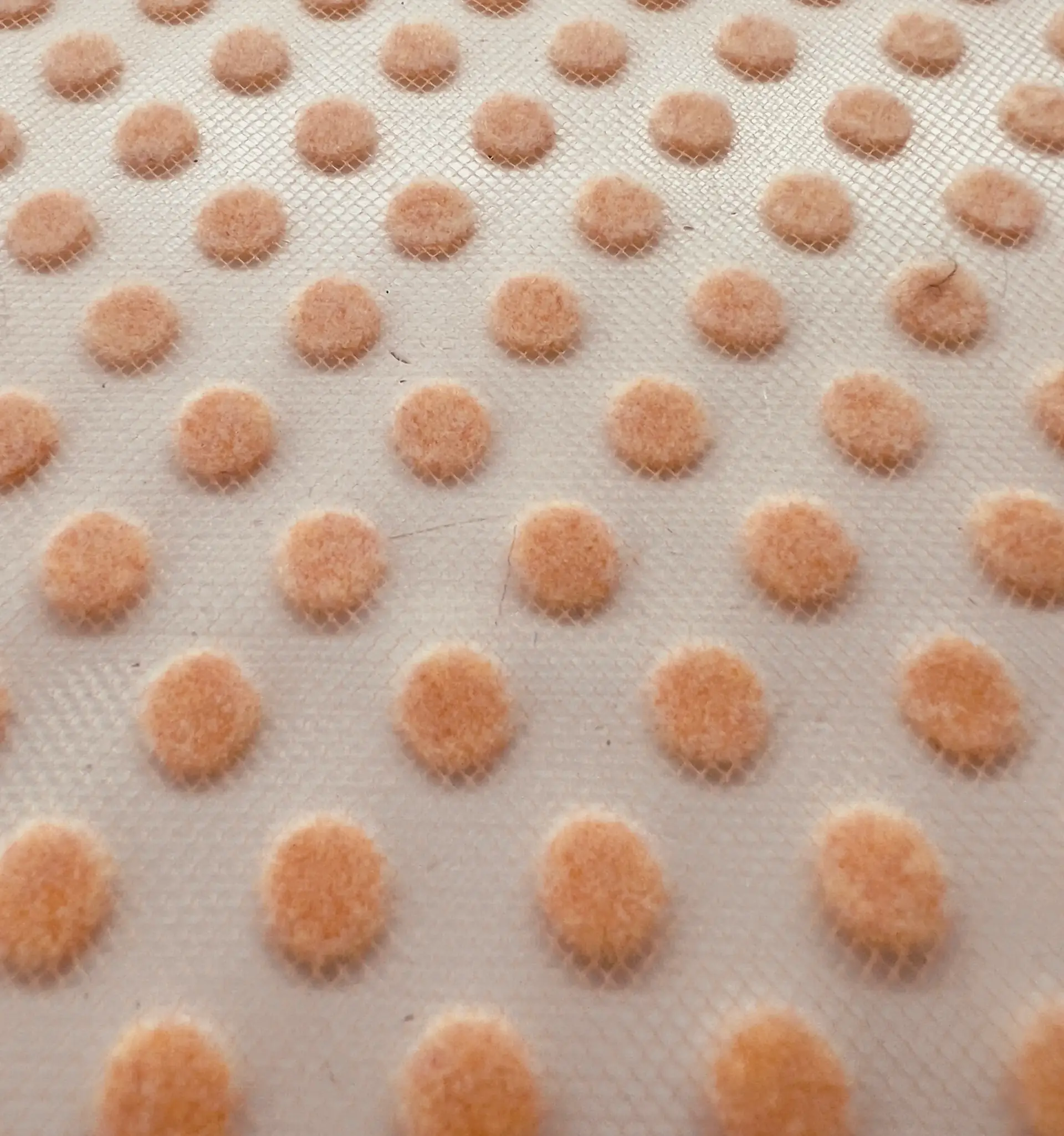 Flocking on tulle in Peach