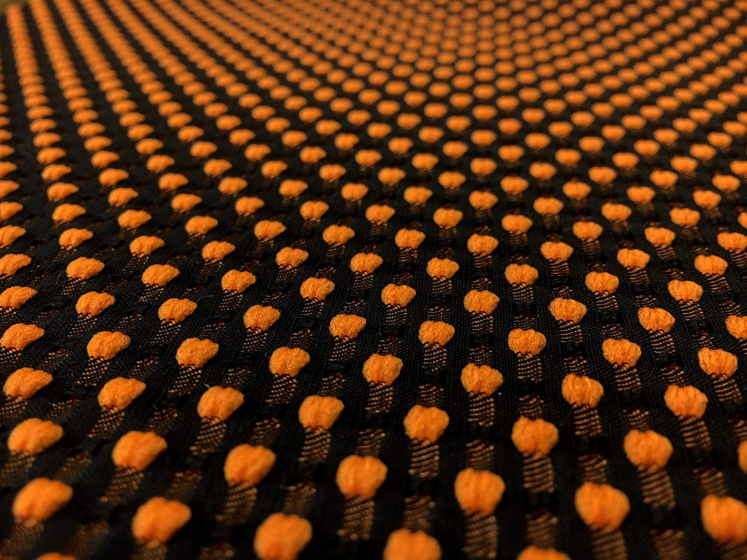 Polyester Swiss Dot Brocade with Orange Dots