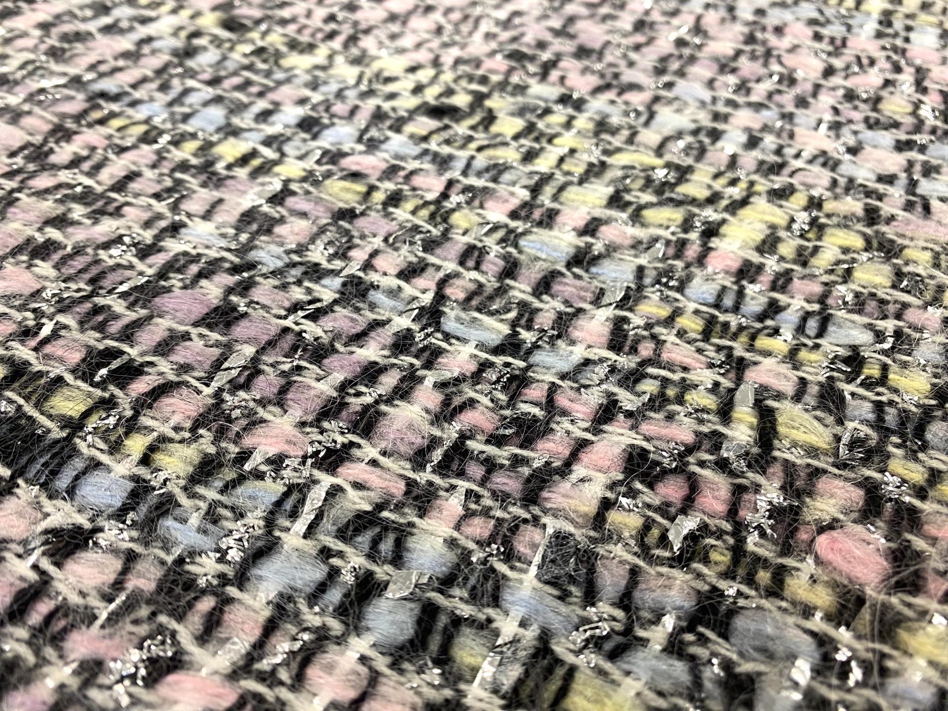 Wool and mohair lurex tweed fabric in warehouse